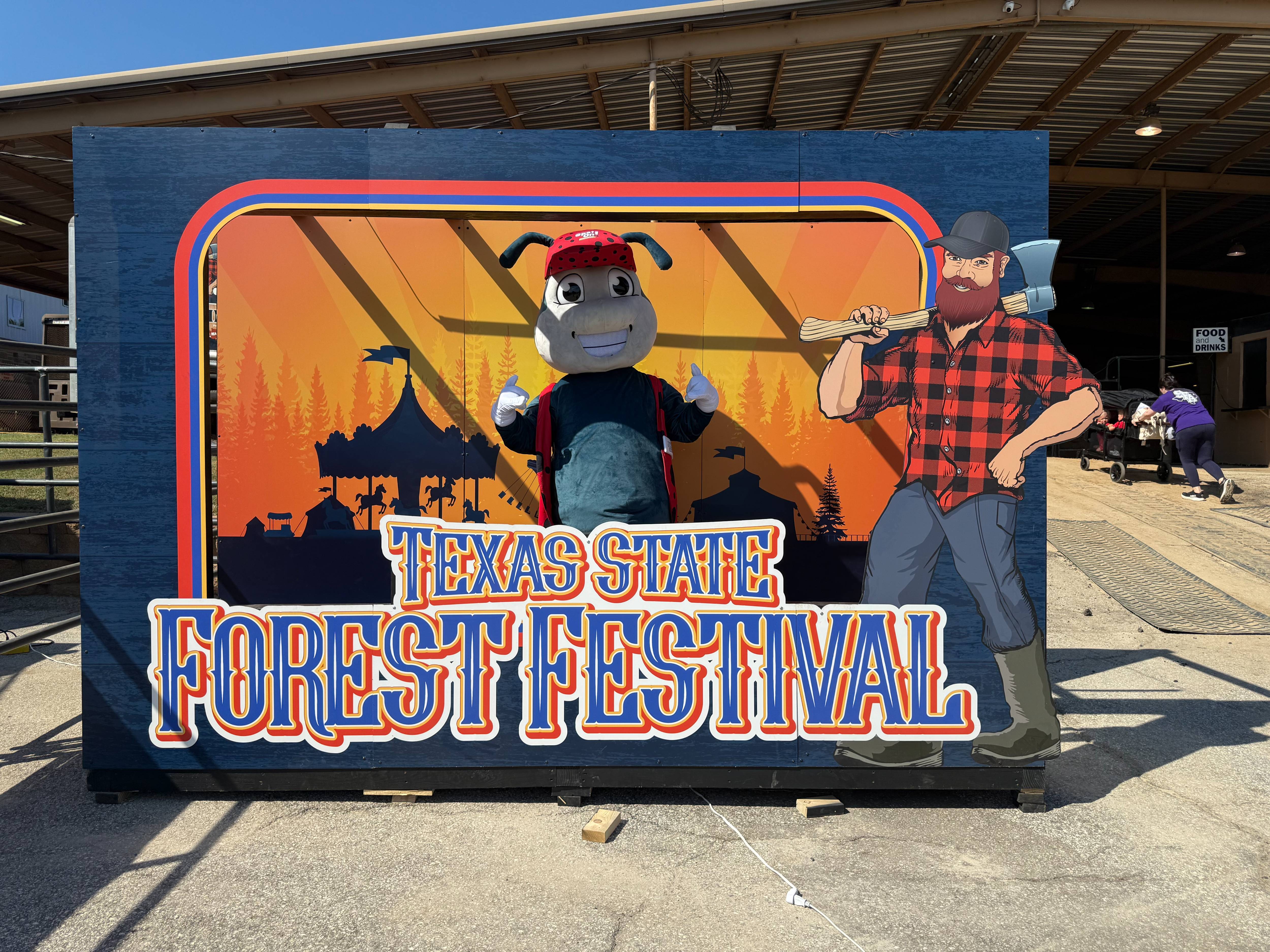Johnnie mascot at the Texas State Forest Festival photo booth